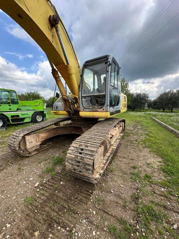 New Holland 305 Foto 4