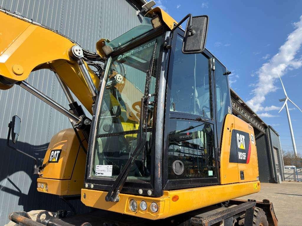 Caterpillar M315F - With OilQuick Foto 6