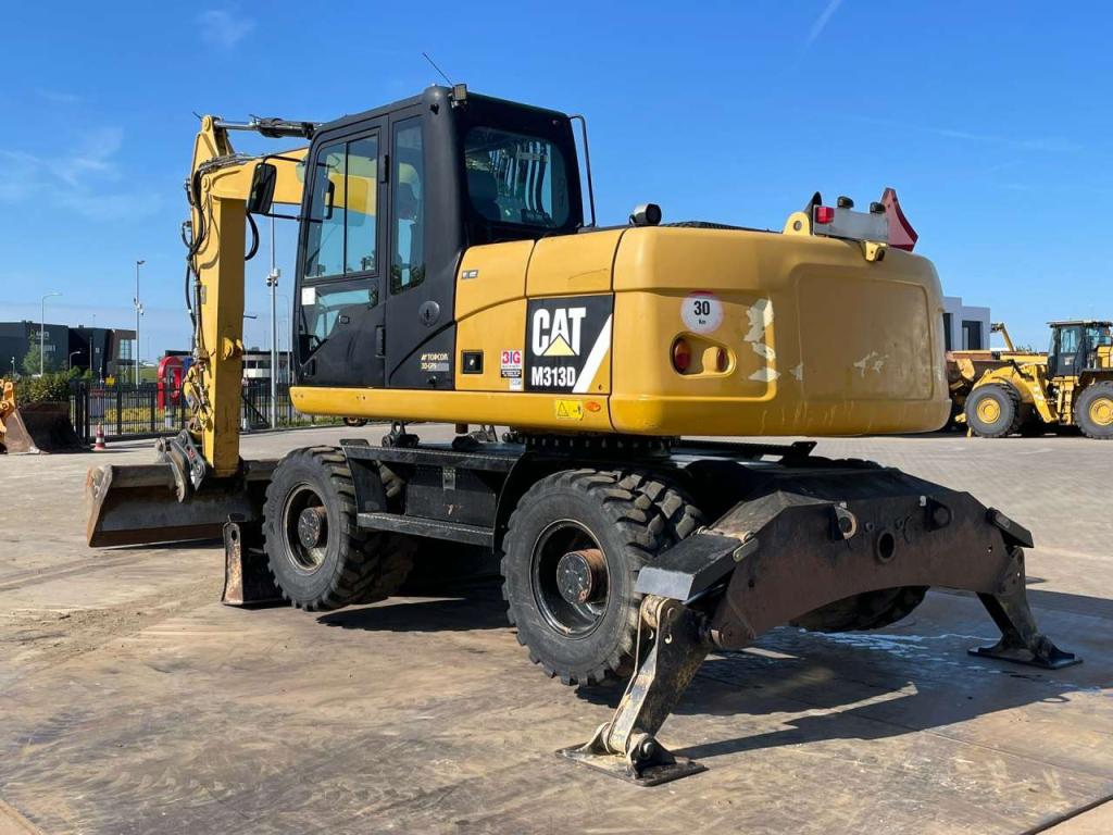 Caterpillar M313D VA - Outriggers + Blade Foto 3