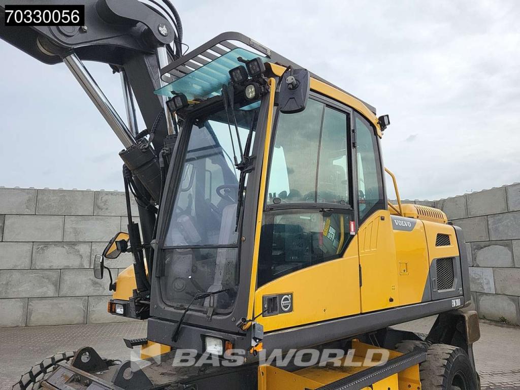 Volvo EW210 D Outrigers + Blade Foto 29